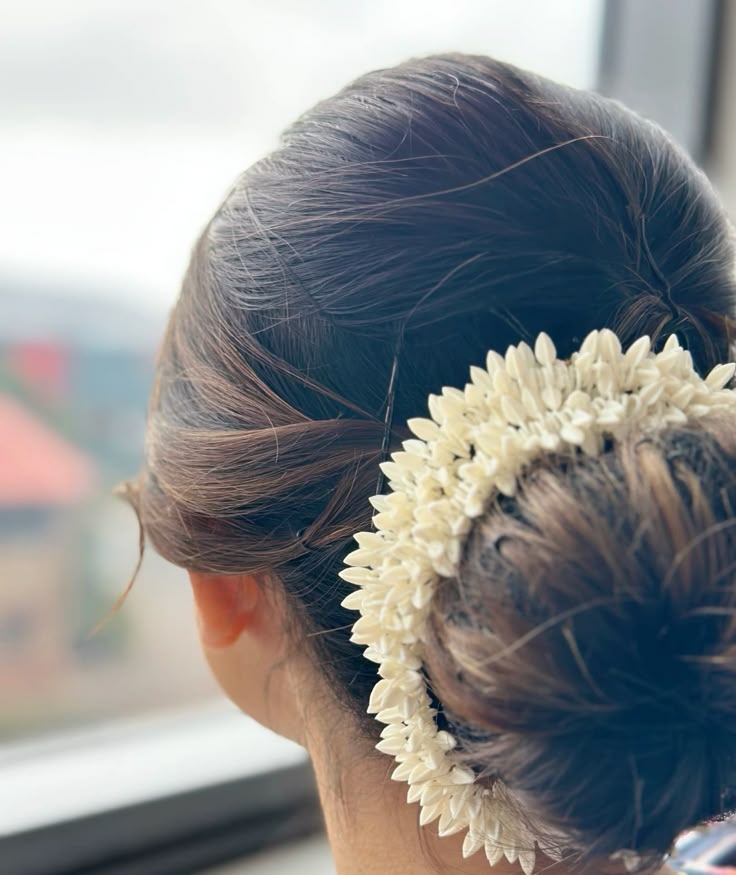 A woman wearing Bindee scented Gajra scrunchie.